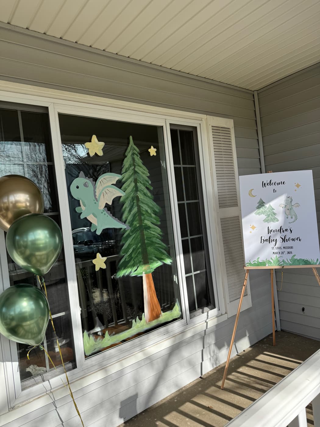 Baby shower dinosaur window painting by Rachael